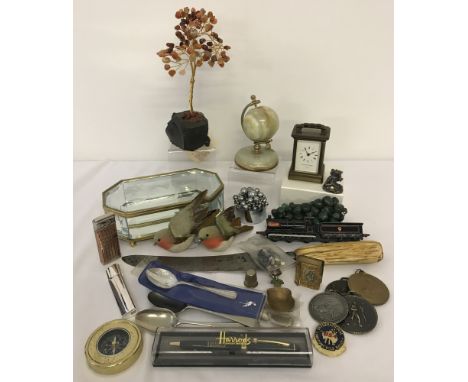 A collection of assorted misc. items. To include: Matthew Norman brass cased carriage clock, agate globe, compass, lighter an