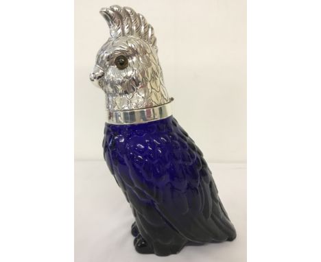 A heavy Bristol blue glass claret decanter in the shape of a parrot.  Approx. 25cm tall.