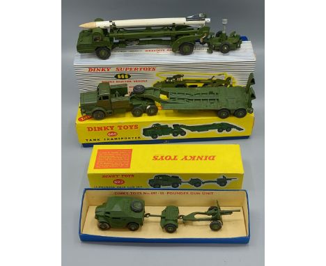 Dinky Supertoys Missile Erector Vehicle number 666 together with another 25-pounder Field Gun Set number 697 and another Tank