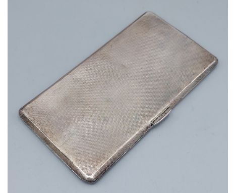 A Birmingham silver cigarette case with engine turned decoration, 7ozs