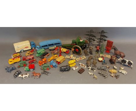 A tin plate clockwork model of a Cannon together with a collection of model vehicles, lead farm figures and related
