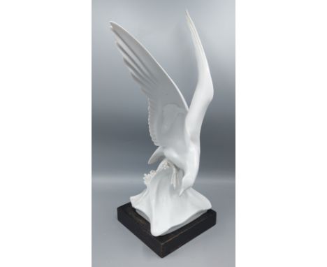 A large Meissen porcelain model of a Seagull, blue crossed swords mark, with wooden plinth, 40cms tall
