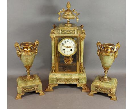 A 19th Century French three piece clock garniture comprising a four glass Library clock, the enamel dial with Roman numerals 