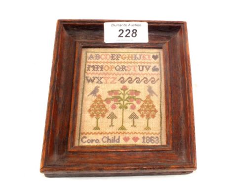An 1863 miniature alphabet sampler, signed Cara Child, 3 1/2" x 3"
