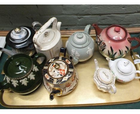 Various teapots to include Dudson stoneware, Devon ware with butterfly applique etc (two trays)