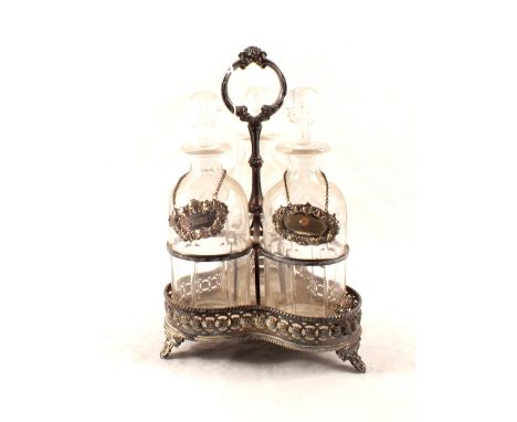 A silver plated three decanter stand with cut glass decanters