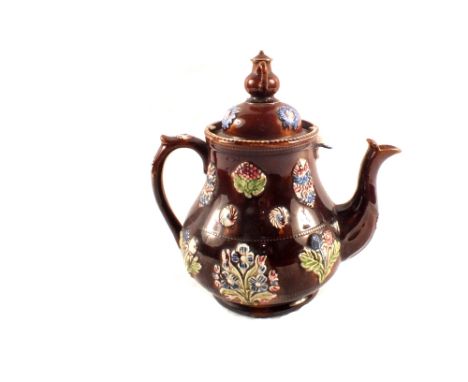 A Victorian Bargeware teapot inscribed 'Like It Good' (repaired finial)