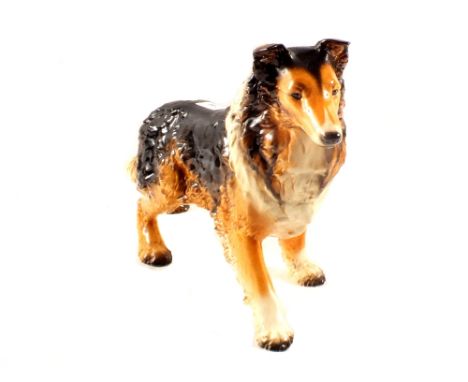 A German Goebel pottery figure of a dog
