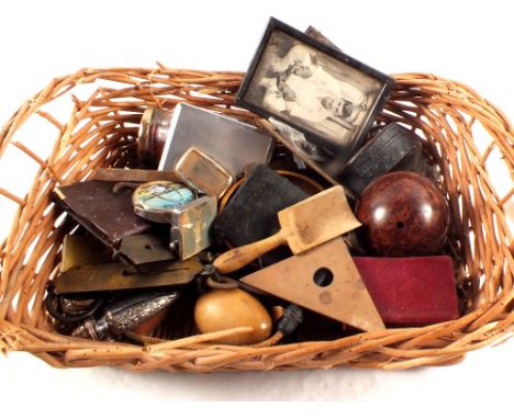 A basket of small sundries including scales, lighters etc