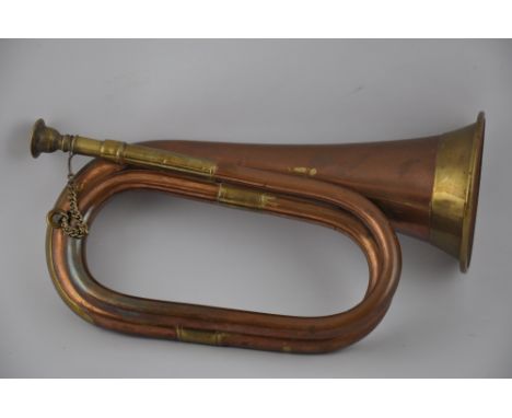 A 20th century copper and brass bugle, L. 28cm.