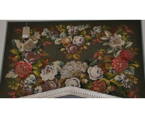 A Victorian woolwork tapestry panel, worked with a polychrome floral spray. 80cm x 120cm.