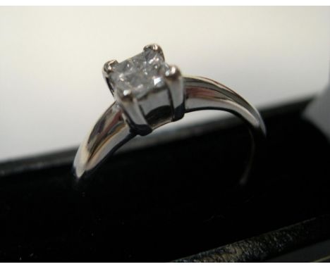 18ct white gold & diamond ring with 4 princess cut diamonds, rubbed marks.Approx 2.7 grams gross,          size K 