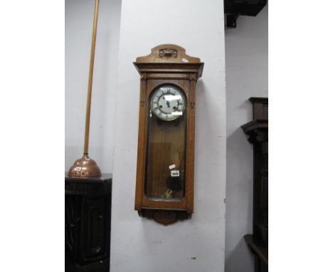 An Early XX Century Oak Wall Clock, white enamel, Roman numerals, glazed door and sides.