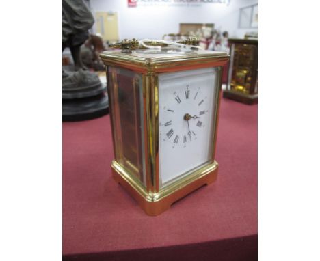 A French Brass Cased Carriage Clock, with bevelled glass panels, back plate stamped L'Epee over cross swords, 13.5cm high wit