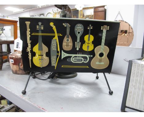 A Circa Mid XX Century Worcester Ware Magazine Rack, decorated with musical instruments, 32cm high, 43cm wide.