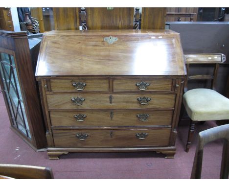 A Georgian Mahogany Bureau, with fall front, pigeon hole and waterfall interior, two short and three long graduated drawers o