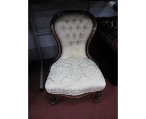 A XIX Century Balloon Back Nursing Chair, re upholstered in a cream button back floral damask .