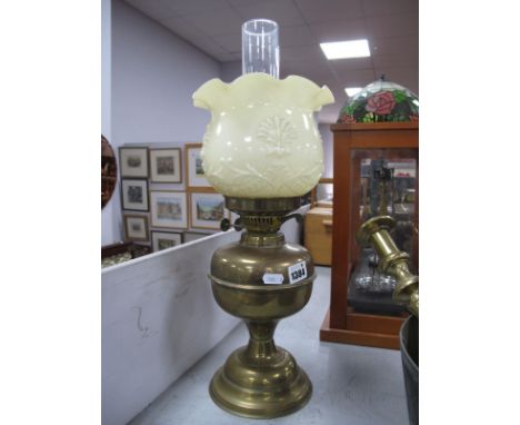 A Brass Oil Lamp, with yellow glass shade.