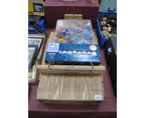 A Reeves Artists Folding Sketch Box/Easel, containing a quantity of oil paints, palette and Winsor &amp; Newton set of ten oi