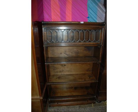 A Globe Wernicke style five tier Oak Bookcase having moulded top, the upper section having leaded glazed up and over door, ov