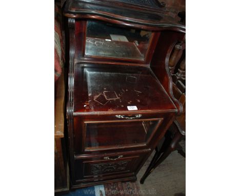 A late Victorian stained Beech double purdonium style Music Cabinet, having swan pediment, over shaped upper shelf, over mirr