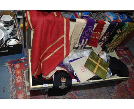A large quantity of Ecclesiastical Garments, sashes, etc. in a metal trunk.