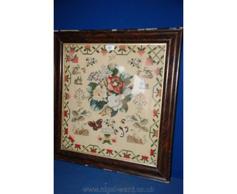 A large Victorian Sampler depicting flowers and animals, A. Lloyd.