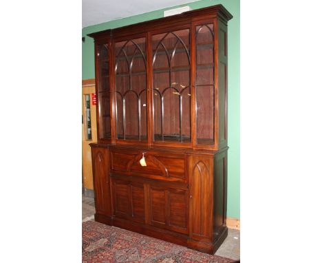 A stunning early 19th c. Mahogany Gothic influenced Breakfront Secretaire Bookcase of impressive stature, having moulded corn