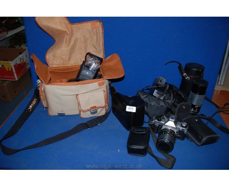 A quantity of Cameras including cased Canon, Kodak, Polaroid instant camera, etc.