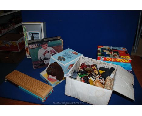 Miscellaneous doll's house furniture, six jigsaws, cribbage board, Stylophone electronic organ, Pound Puppy Yappies, etc.
