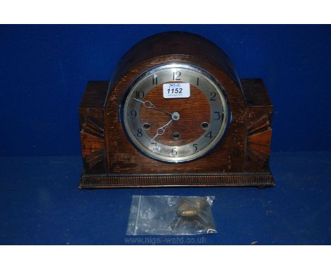 An Oak mantel Clock, with key
