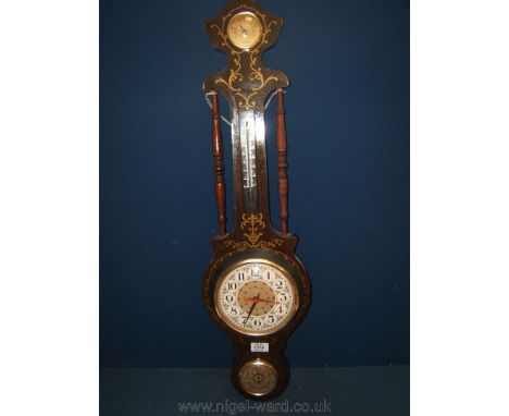 A Secco Normale Umido Barometer with gilt coloured transferred scrolls