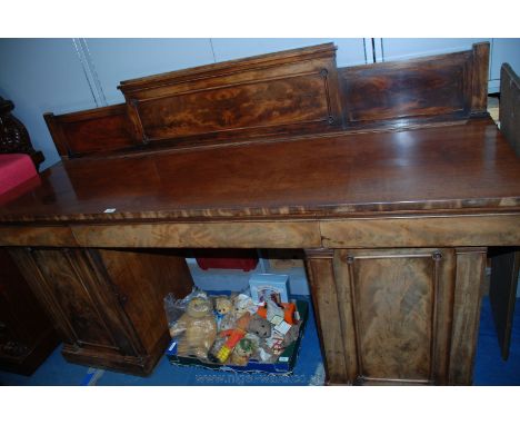 An early 19th c. Mahogany Sideboard, having three panel upstand back with moulded detail, rectangular top over wide central p