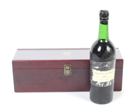A bottle of 1871 Serafim Cabral Vintage Tawny Port, bottled in the 1970s. Within a wooden case and with four accessories. 