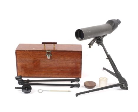 A shooting telescope complete with tripod, in wooden case. Condition Report: Black item in photo is a bracket for the tripod.