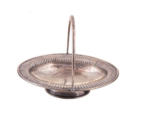 VICTORIAN SILVER CAKE BASKET MAKER'S MARK RUBBED, LONDON 1883 of navette form with swing handle, the bowl engraved with folia
