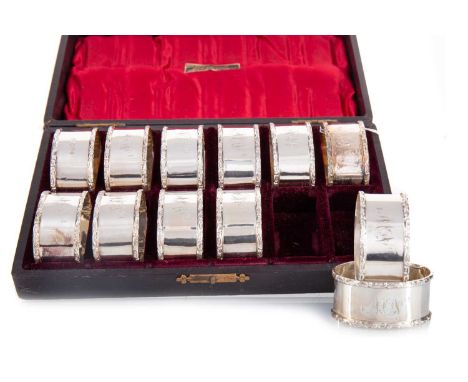 SET OF TWELVE VICTORIAN SILVER NAPKIN RINGS LEE &amp; WIGFULL, SHEFFIELD 1895 each of oval form with scroll cast borders, eng