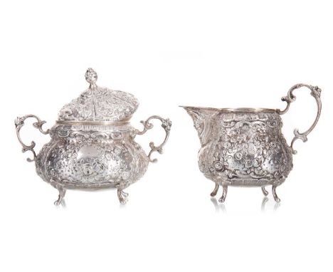 LATVIAN SILVER SUGAR BOWL AND CREAM JUG CIRCA 1922-39 both with engraved date of 1930, chased and embossed with panels of fol