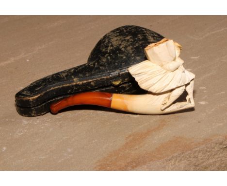 A late 19th century meerschaum pipe, carved as a lady of wearing a flowing skirt, 8.5cm long, cased 
