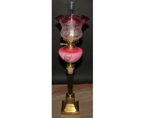 A Victorian brass and vaseline glass Corinthian column table oil lamp, adjustable burner, etched cranberry flash shade, stepp