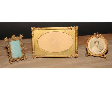 An Art Nouveau turquoise mounted gilt metal easel photograph frame, 9cm high, c.1905; others (3) 