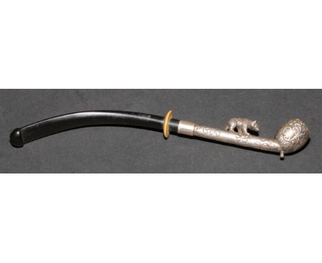 An early 20th century silver coloured metal pipe or cheroot holder, the stem surmounted by a bear, 13.5cm long 