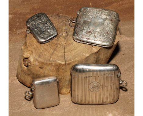 A George V silver curved rounded rectangular vesta case, engine turned, hinged cover, 5.5cm wide, Birmingham 1915; others, va