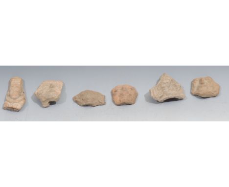 A group of six pre Columbian terracotta mask fragments, probably Aztec or Toltec 