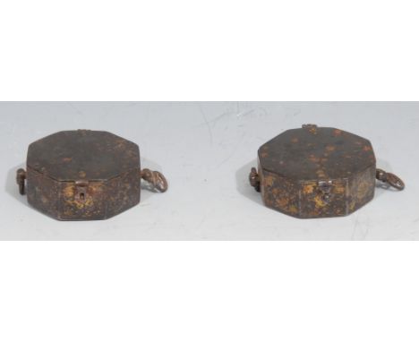 A pair of 18th century Indian octagonal gold inlaid steel Betel lime boxes, decorated with styalised flowerheads, hinged cove