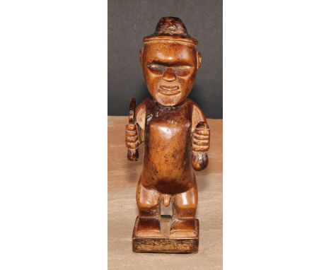 Tribal Art - a Bembe Biteki figure, he stands, holding a knife and a gourd, 16cm high 