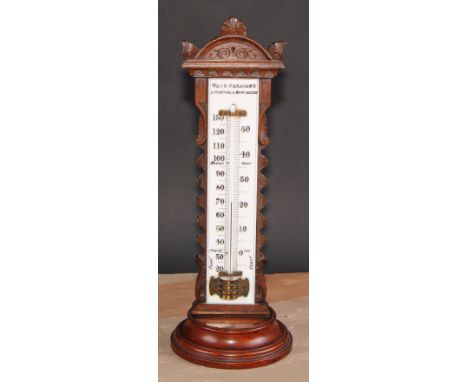 A large and unusual Victorian walnut table top thermometer, the opaque glass register inscribed Wood Abraham's, Liverpool &am