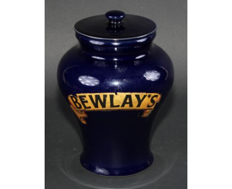 A stoneware Bewlays inverted baluster tobacco or snuff jar and cover labeled in gilt on a cobalt blue ground, flush cover, bu