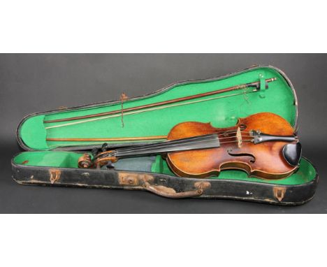 A violin, the one-piece back 36.5cm long excluding button, outlined throughout with purfling, 59.5cm long overall, the bows u