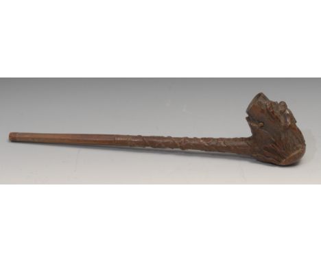 A large Black Forest pipe, the bowl carved with a sportsman and his dog, 44cm long, c.1880 